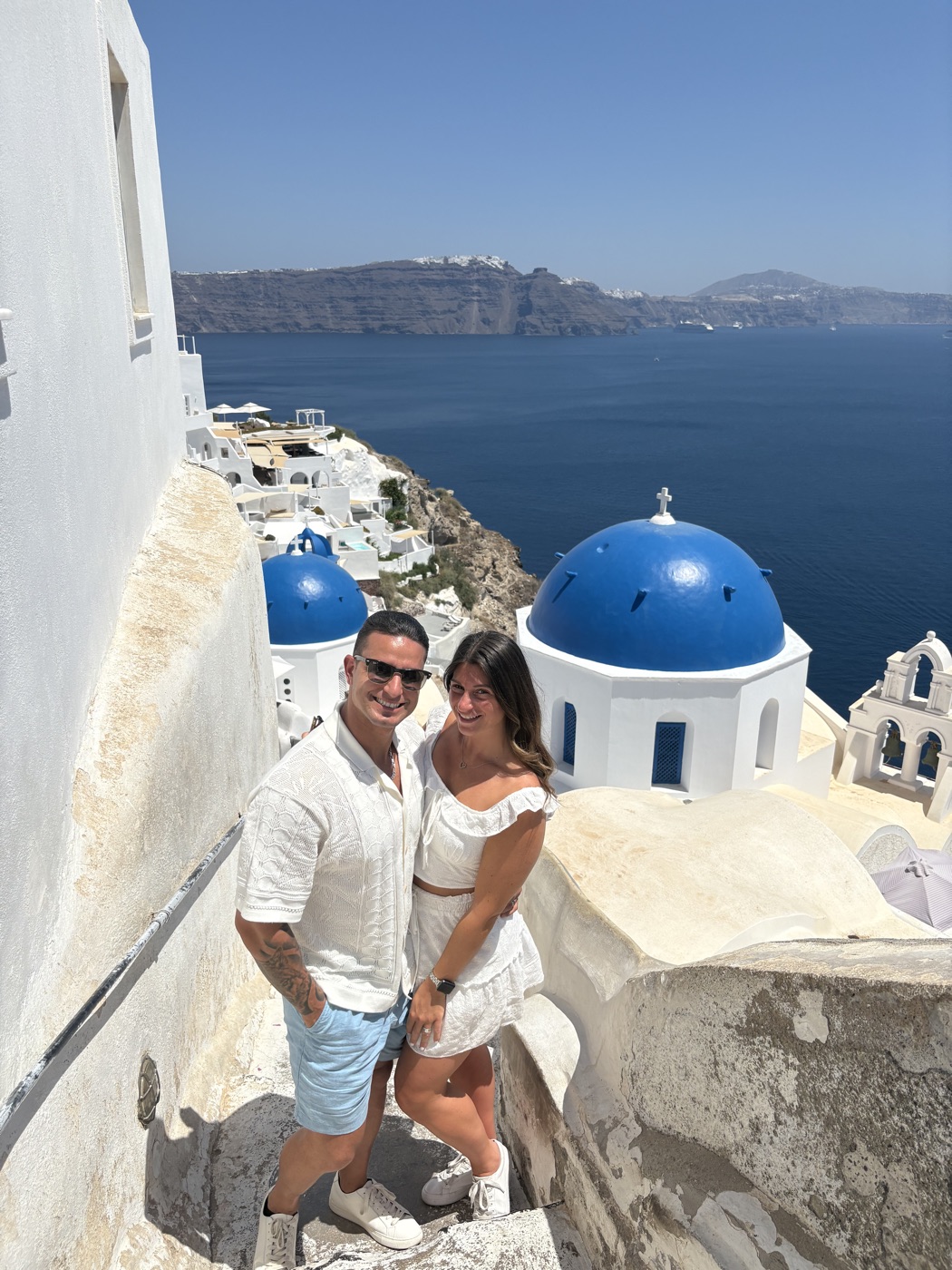 Daniel and Brooke Romolo traveling in Santorini
